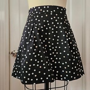 Adorable White House Black Market black skirt with white and cream polka dots.